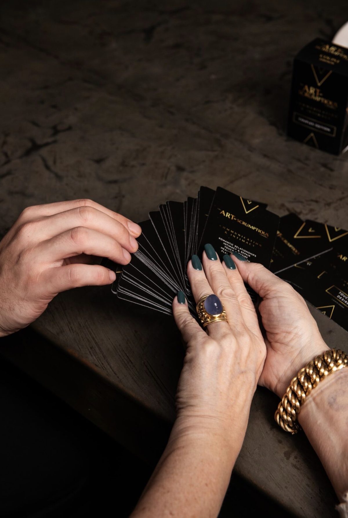 The Intimacy and Communication Cards fanned between two people's hands