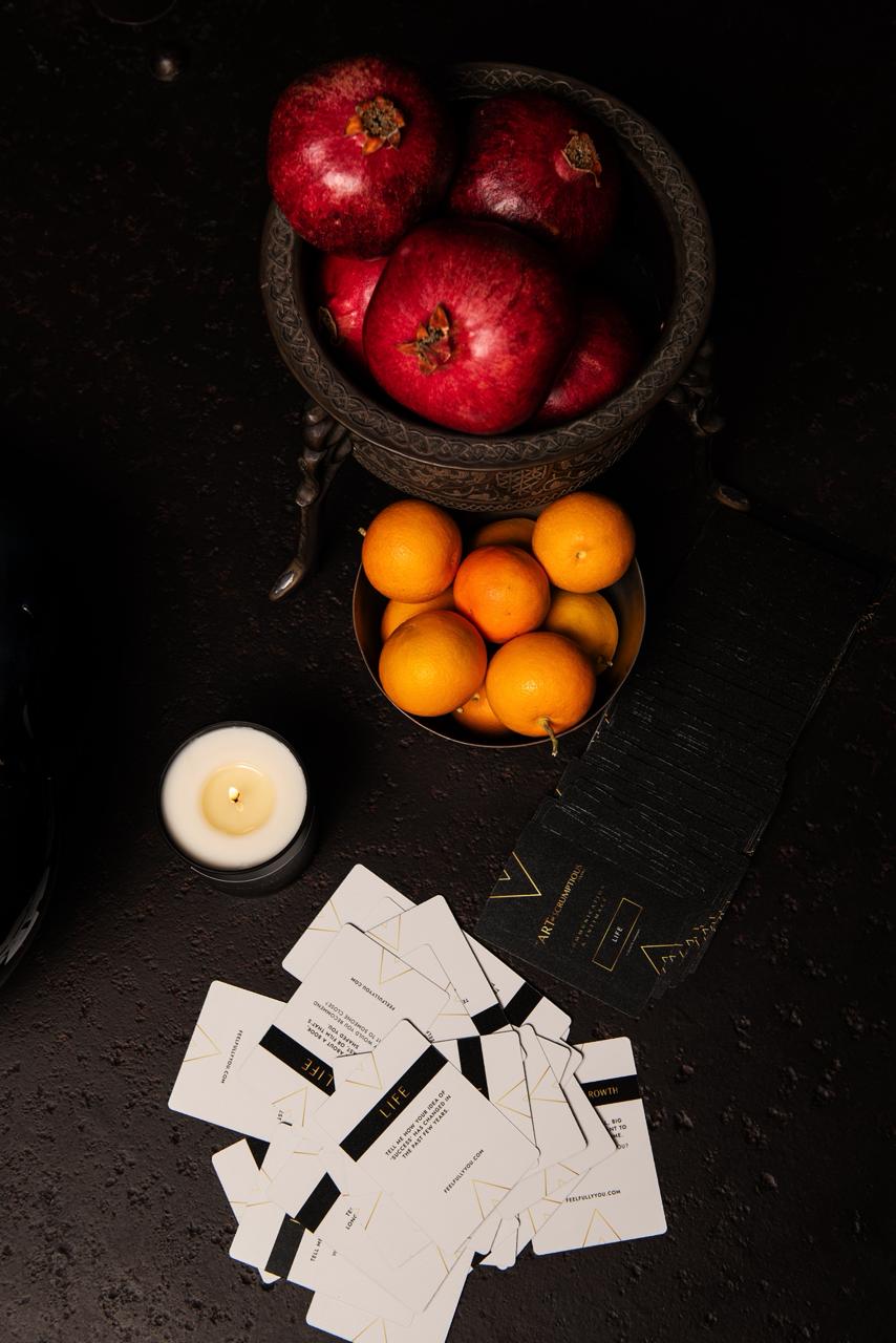 Hands holding the Communication and Intimacy Cards