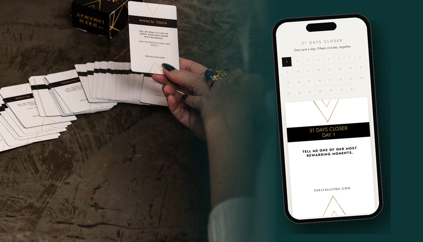 The 31 Days Closer app on a phone next to a hand holding the cards