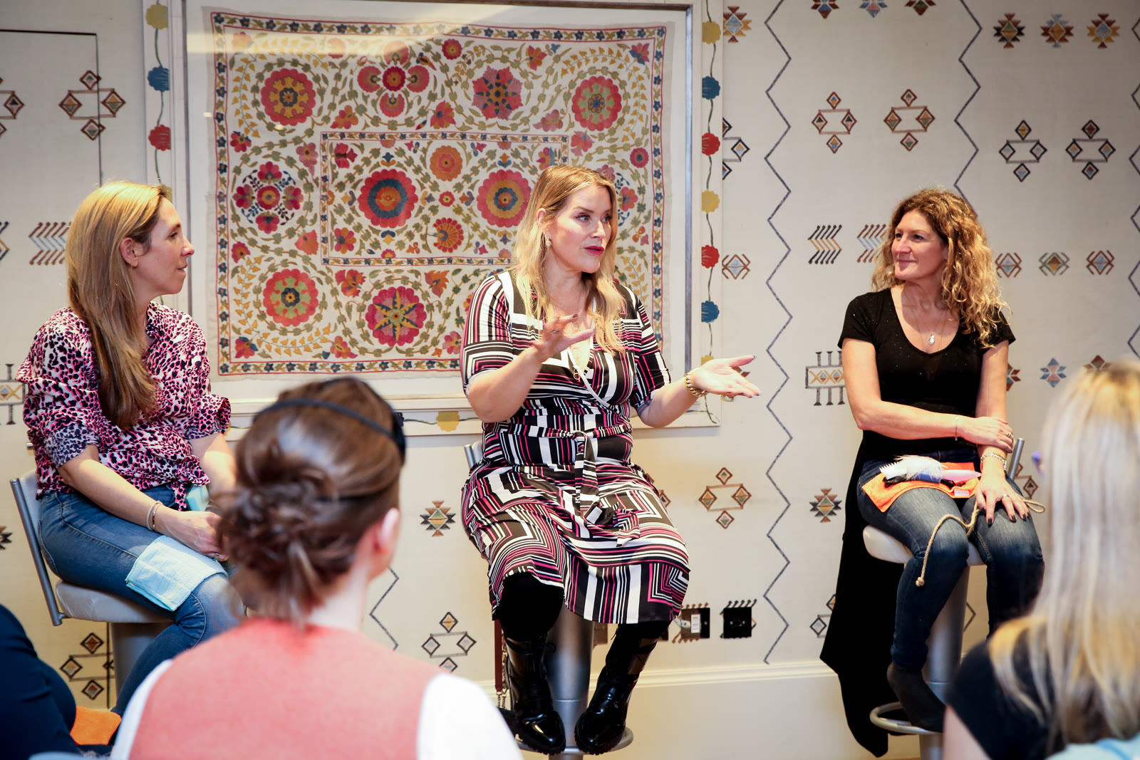 Juliette teaching from a stool at the Essence London evening