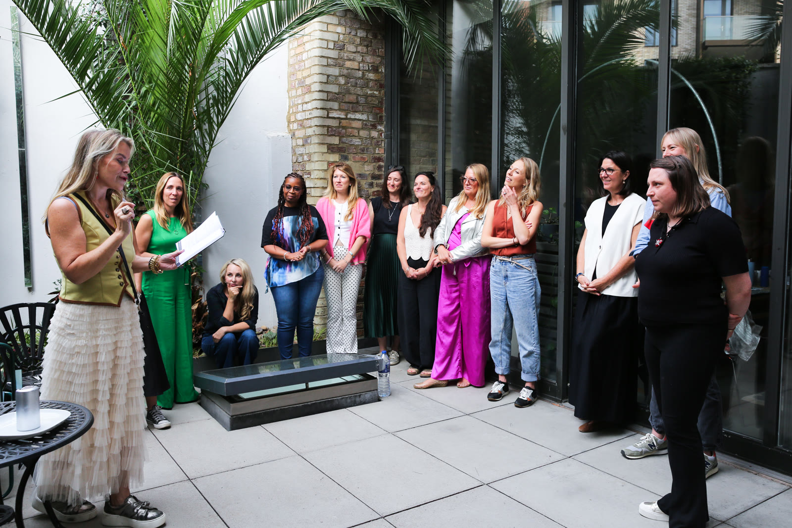 Juliette reading to a circle of women at the Essence retreat