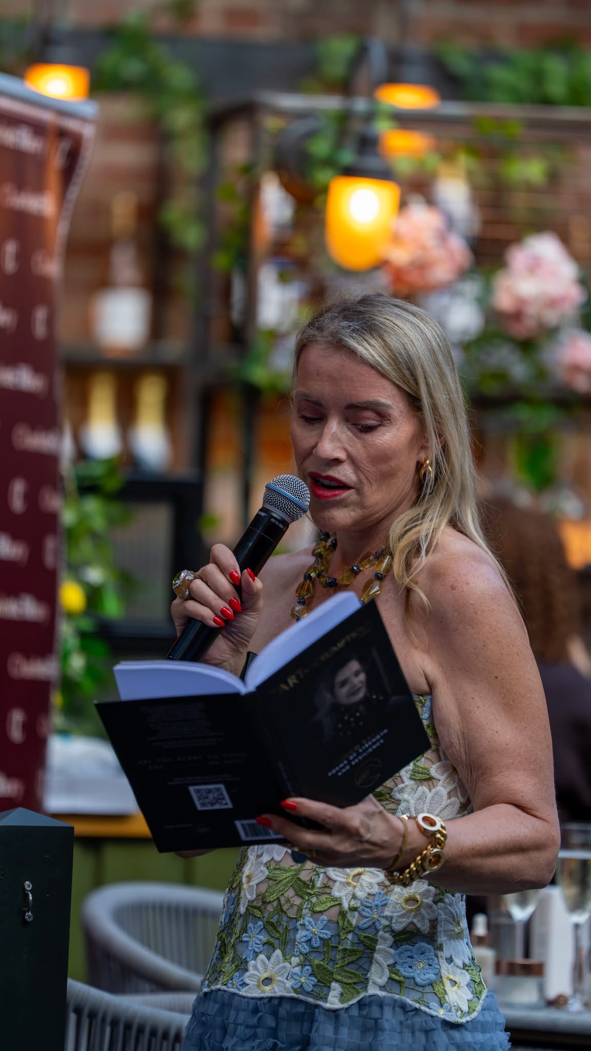 Juliette Karaman reading from her book on stage