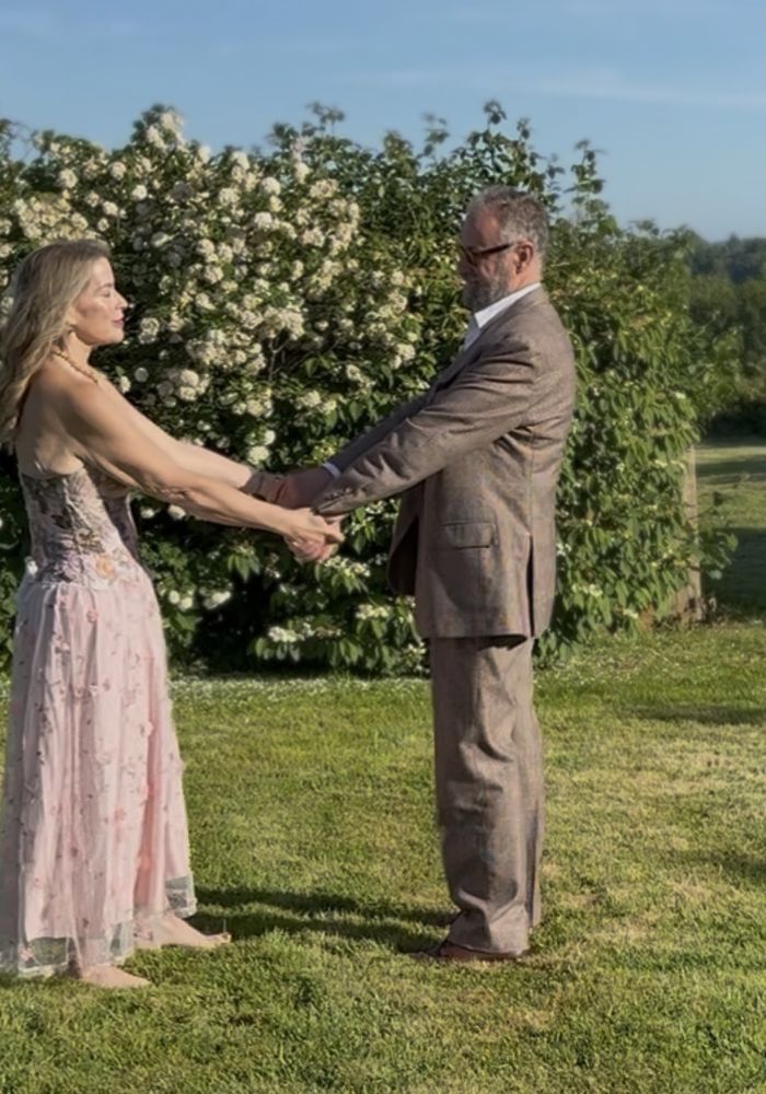 Juliette Karaman dancing with her partner in a field